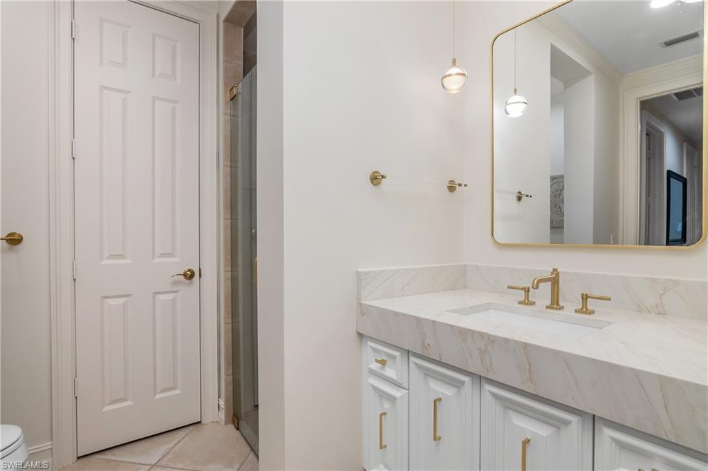 938 Spanish Moss Trail Naples, FL 34108 - Photo 26 of 43 1 of 2 Ensuite Bathrooms