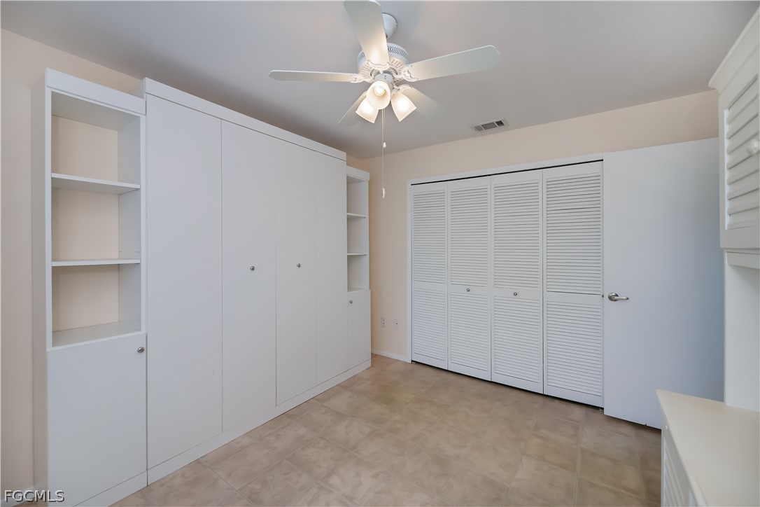 1100 Pondella Road, Unit 514 Cape Coral, FL 33909 - Photo 14 of 34 a view of an empty room with a ceiling fan