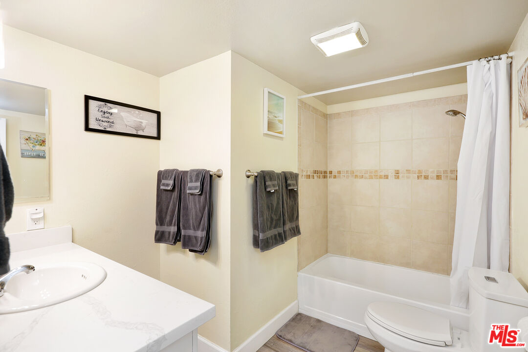 3519 Polk Street Riverside, CA 92505 - Photo 14 of 28 a bathroom with a tub a toilet and a sink