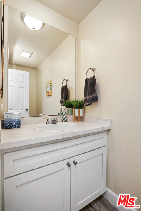 3519 Polk Street Riverside, CA 92505 - Photo 15 of 28 a bathroom with a sink and mirror