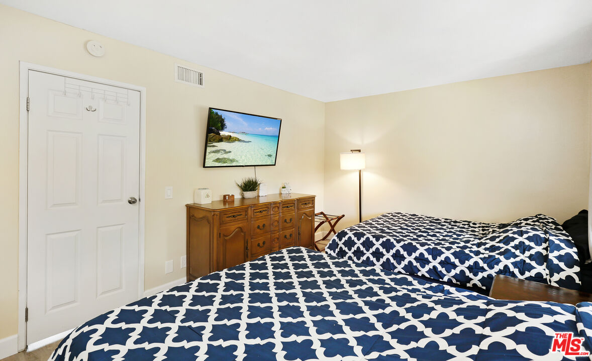 3519 Polk Street Riverside, CA 92505 - Photo 17 of 28 a bedroom with a bed and a lamp