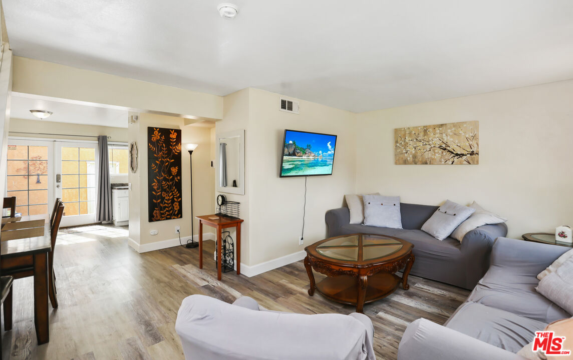 3519 Polk Street Riverside, CA 92505 - Photo 3 of 28 a living room with furniture and a wooden floor