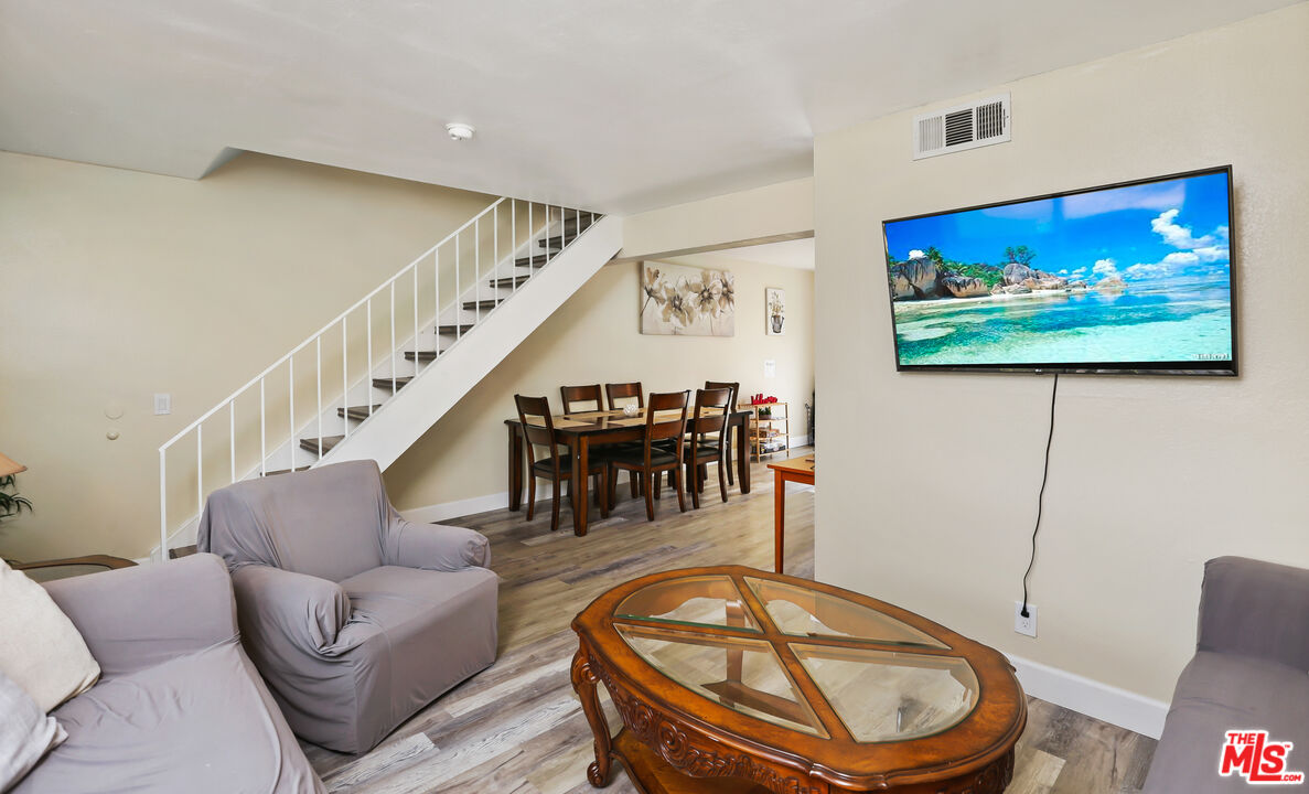 3519 Polk Street Riverside, CA 92505 - Photo 4 of 28 a living room with furniture a piano and a flat screen tv