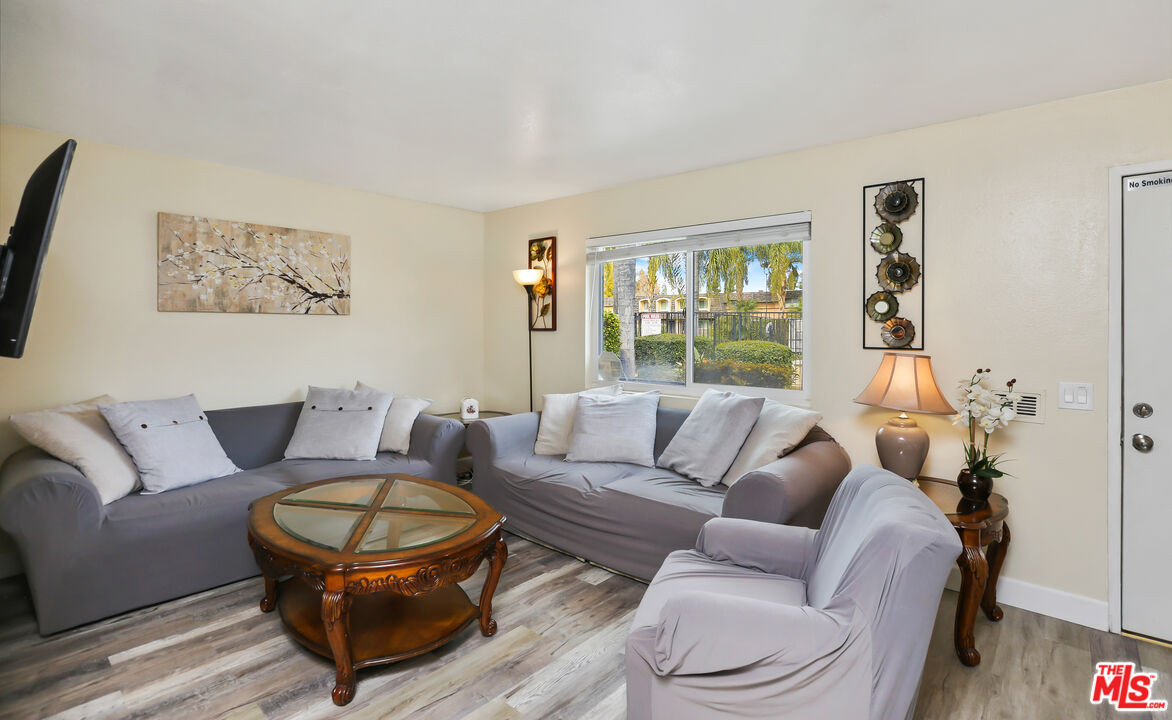 3519 Polk Street Riverside, CA 92505 - Photo 6 of 28 a living room with furniture a rug and a window
