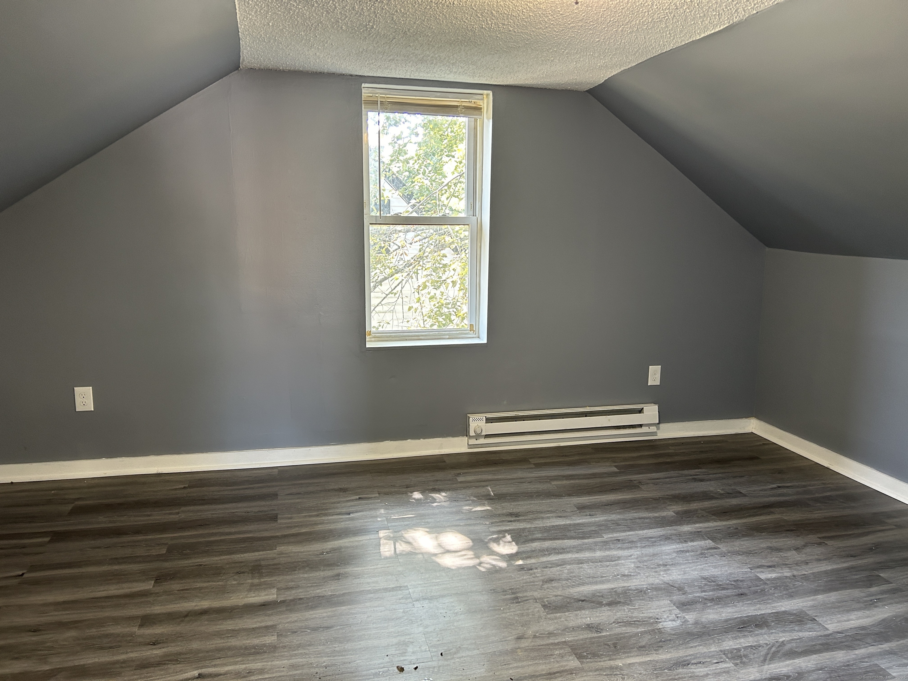 164 Central Avenue Norwich, CT 06360 - Photo 12 of 16 a view of empty room with wooden floor and fan