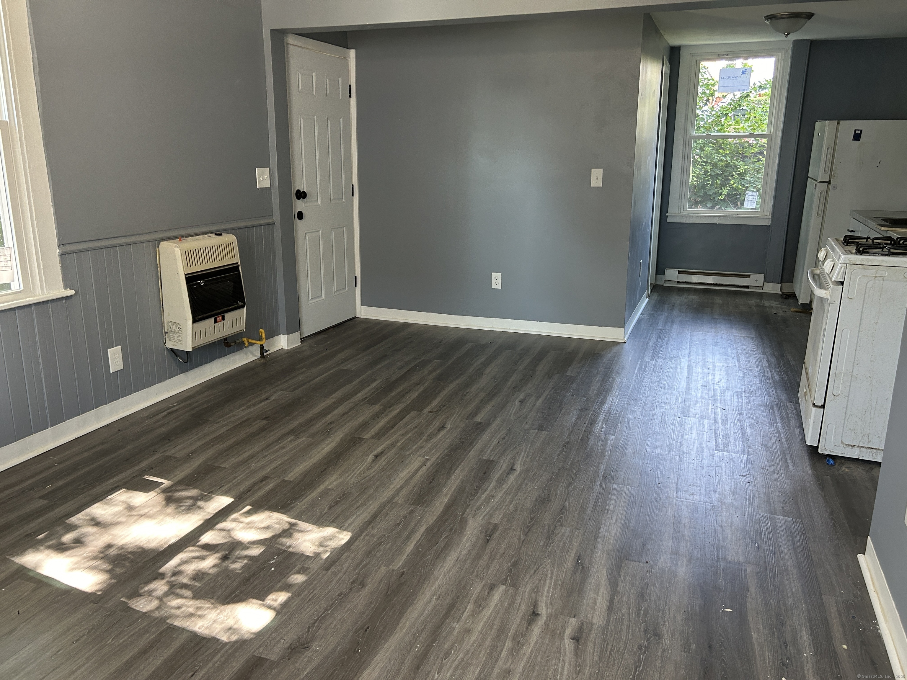 164 Central Avenue Norwich, CT 06360 - Photo 3 of 16 a view of livingroom with furniture and a fireplace