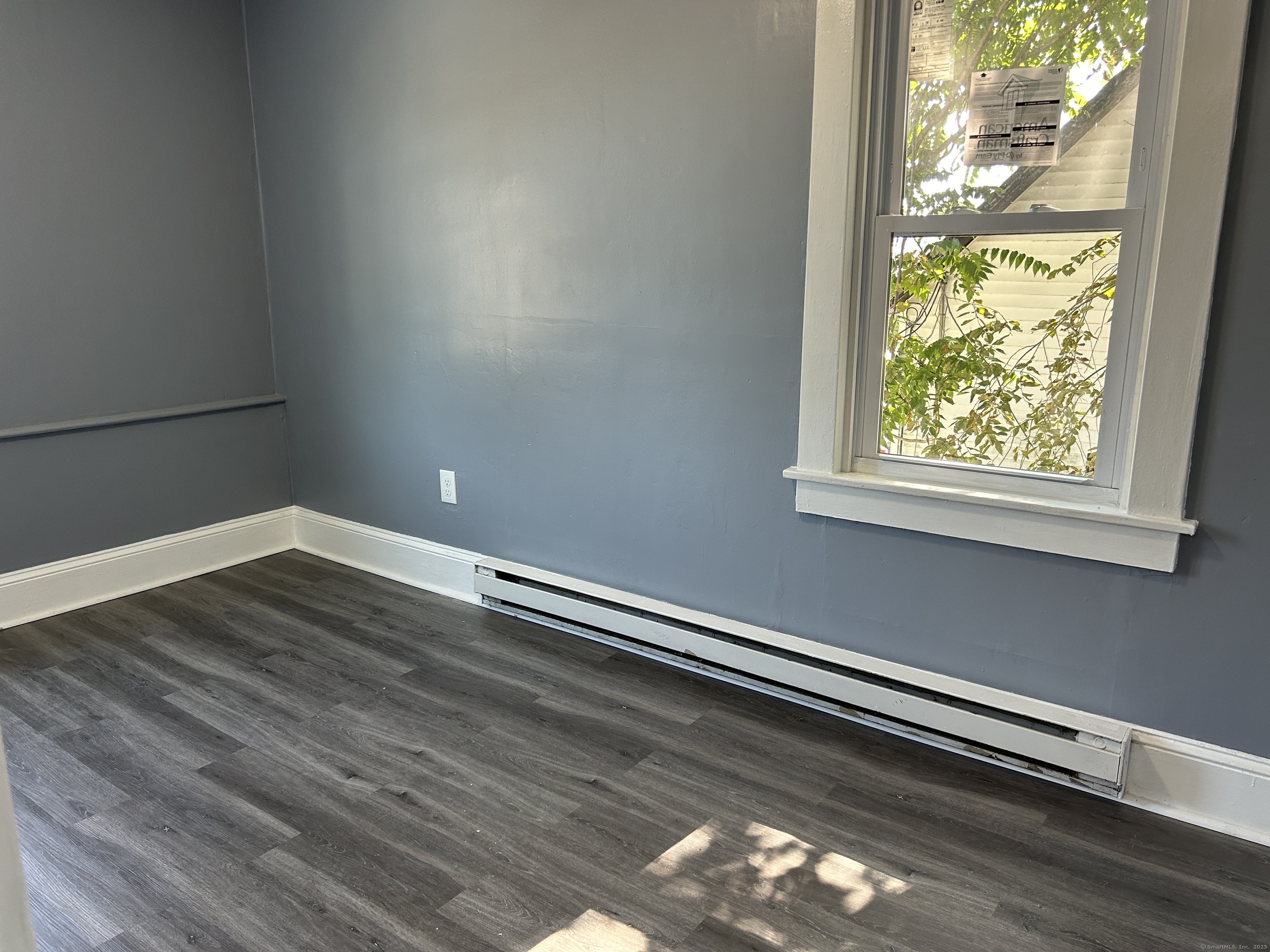 164 Central Avenue Norwich, CT 06360 - Photo 10 of 16 a view of a room with wooden floor and window