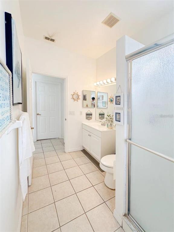 344 Grosvenor Loop Davenport, FL 33897 - Photo 11 of 27 a bathroom with a sink a toilet and shower