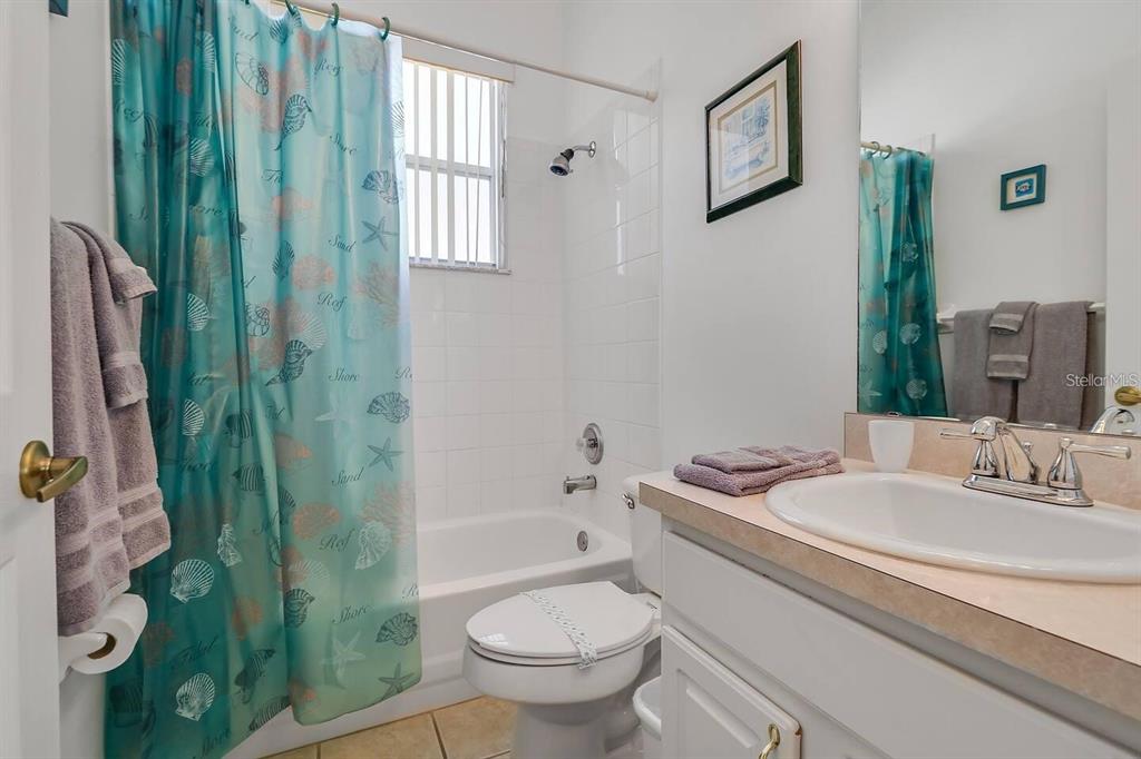344 Grosvenor Loop Davenport, FL 33897 - Photo 13 of 27 a bathroom with a sink a toilet and shower