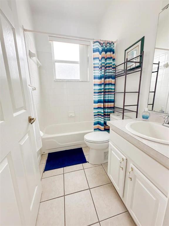 344 Grosvenor Loop Davenport, FL 33897 - Photo 19 of 27 a bathroom with a sink a toilet a tub and shower