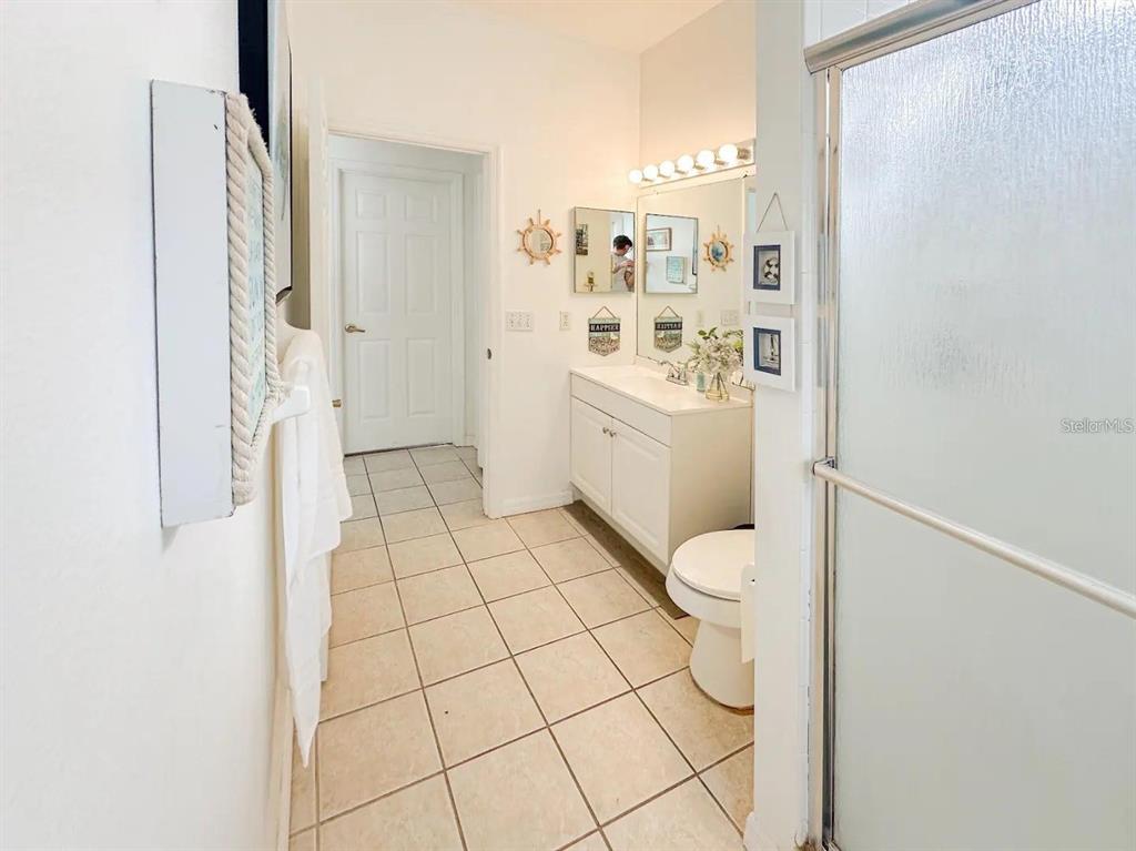 344 Grosvenor Loop Davenport, FL 33897 - Photo 9 of 27 a bathroom with a sink a toilet and shower