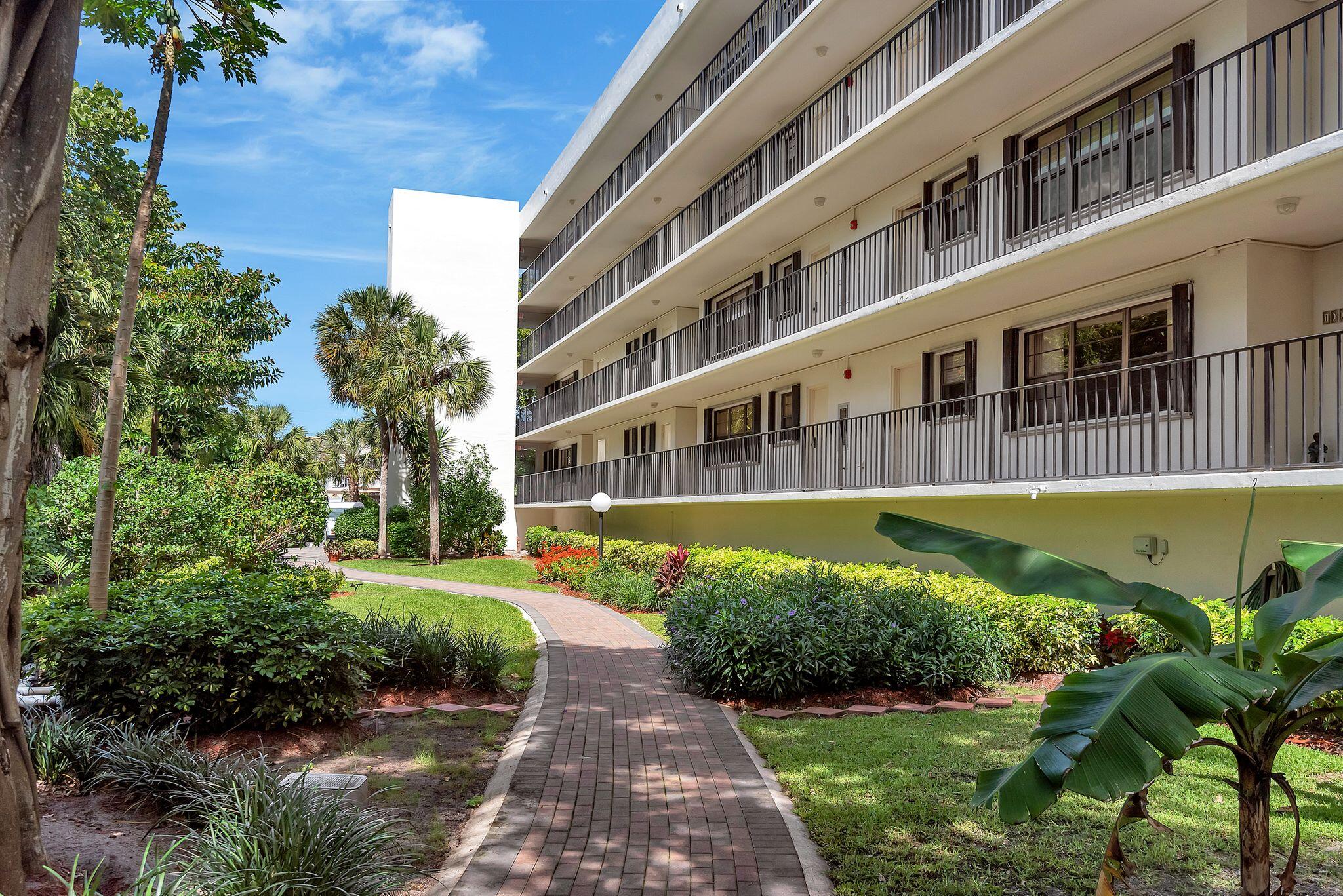 277 North Ocean Boulevard, Unit 2020 Boca Raton, FL 33432 - Photo 1 of 33 a view of a building with a garden
