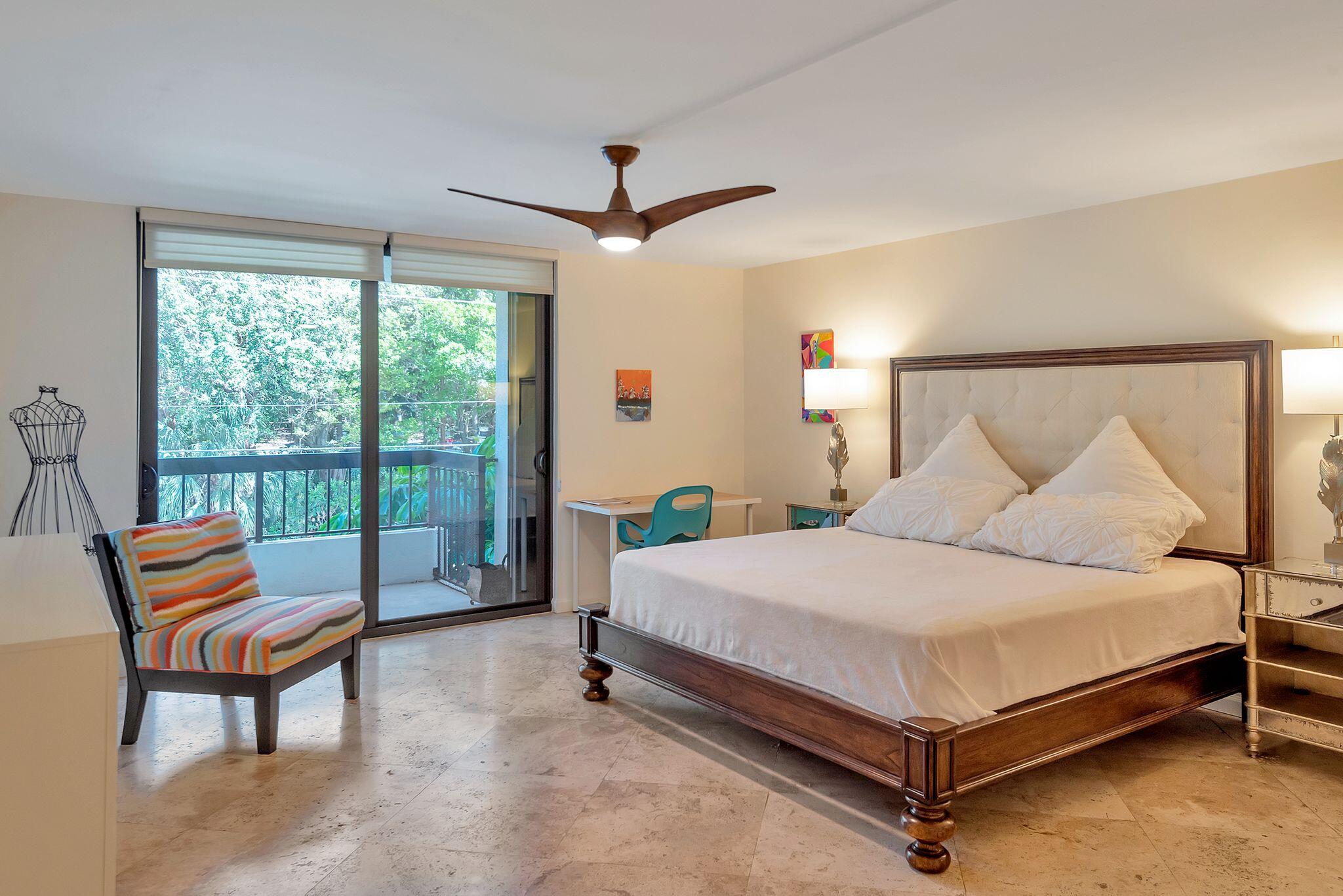 277 North Ocean Boulevard, Unit 2020 Boca Raton, FL 33432 - Photo 15 of 33 a bedroom with a bed and a night stand