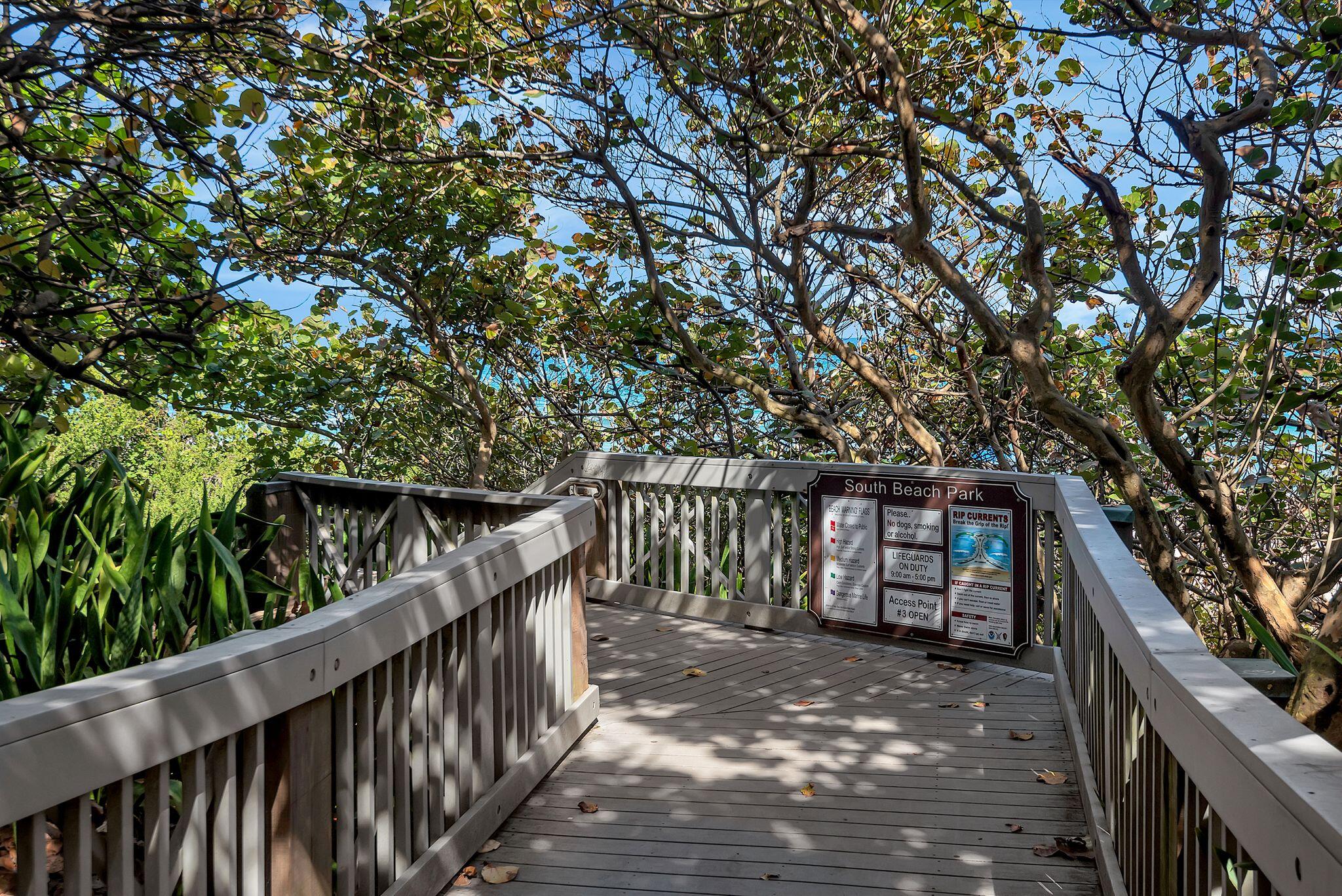 277 North Ocean Boulevard, Unit 2020 Boca Raton, FL 33432 - Photo 27 of 33 a balcony with wooden floor and trees