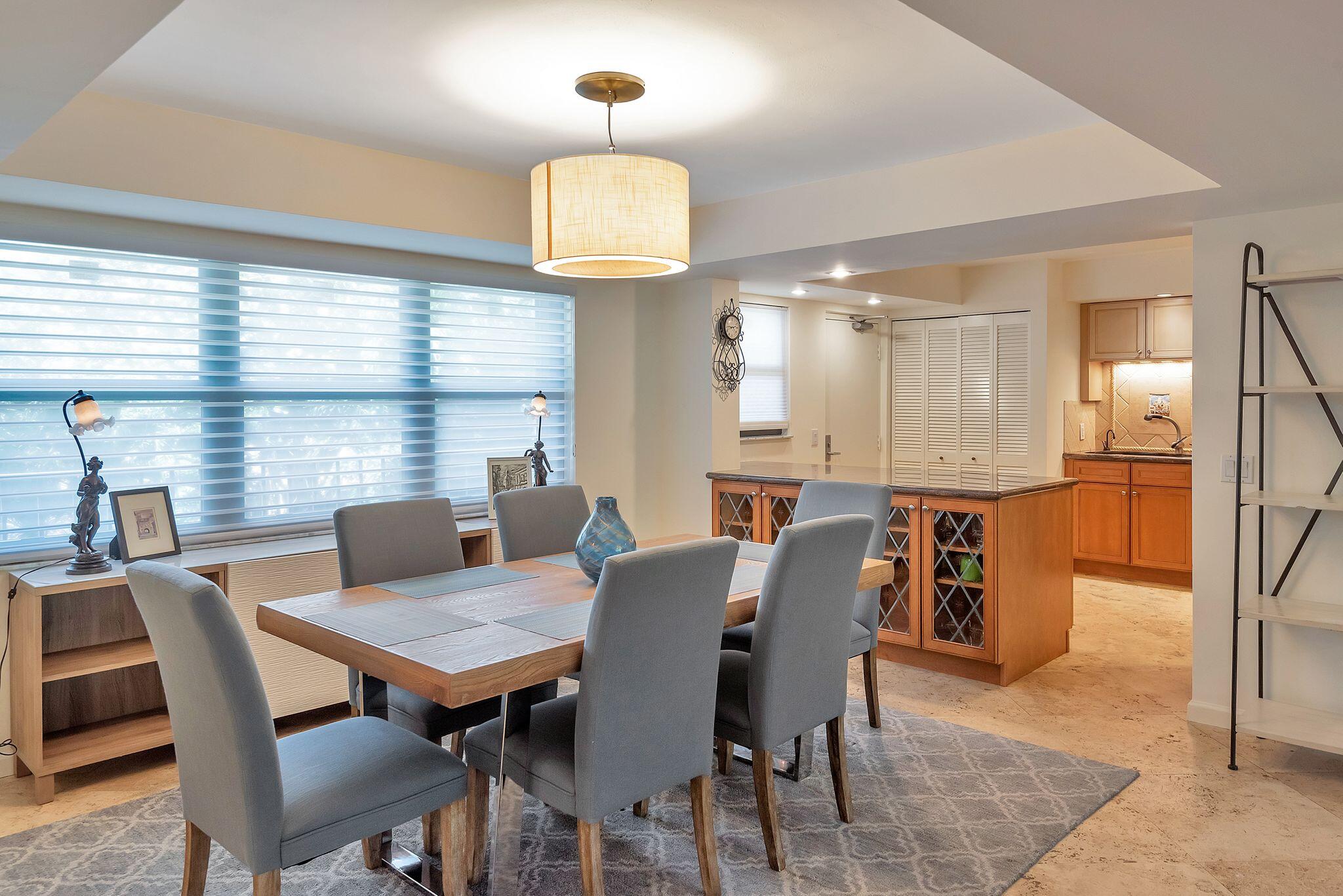 277 North Ocean Boulevard, Unit 2020 Boca Raton, FL 33432 - Photo 9 of 33 a view of a dining room with furniture