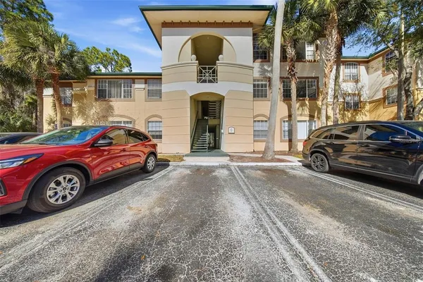 a front view of a house with parking space