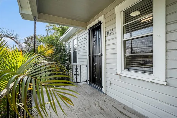 a view of a two chairs in a balcony