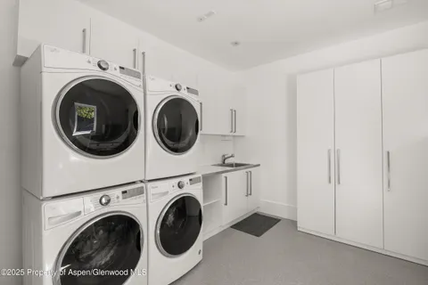 a bed room with a bed and a chair