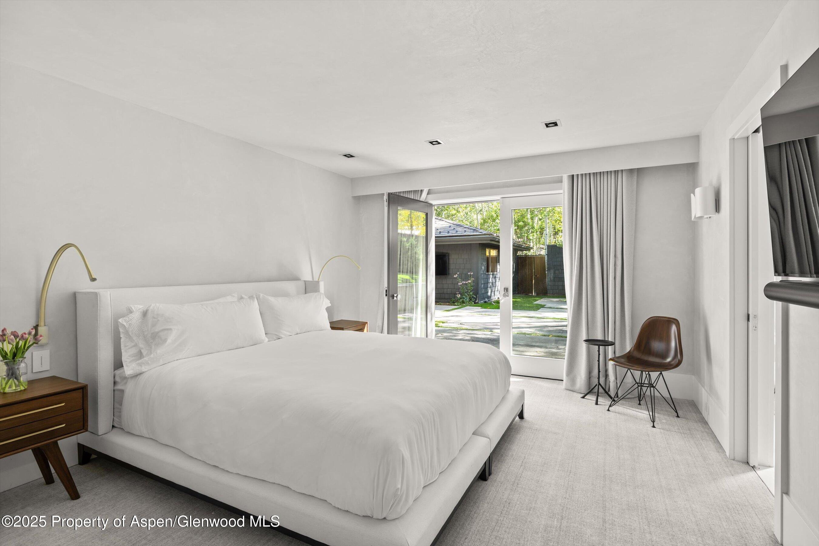 1220 Red Butte Drive Aspen, CO 81611 - Photo 15 of 27 a bed room with a bed and a chair