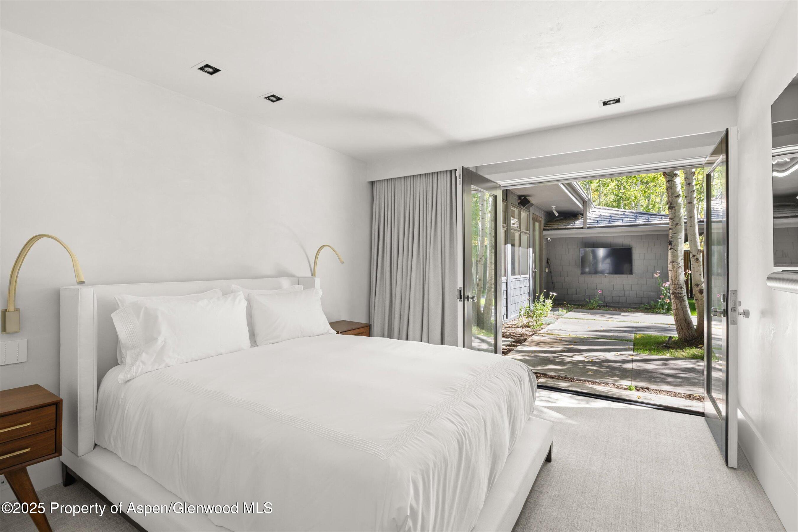 1220 Red Butte Drive Aspen, CO 81611 - Photo 17 of 27 a bedroom with a bed and a window