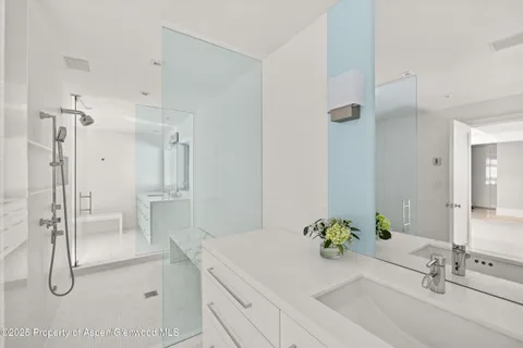 a bathroom with a double vanity sink and mirror