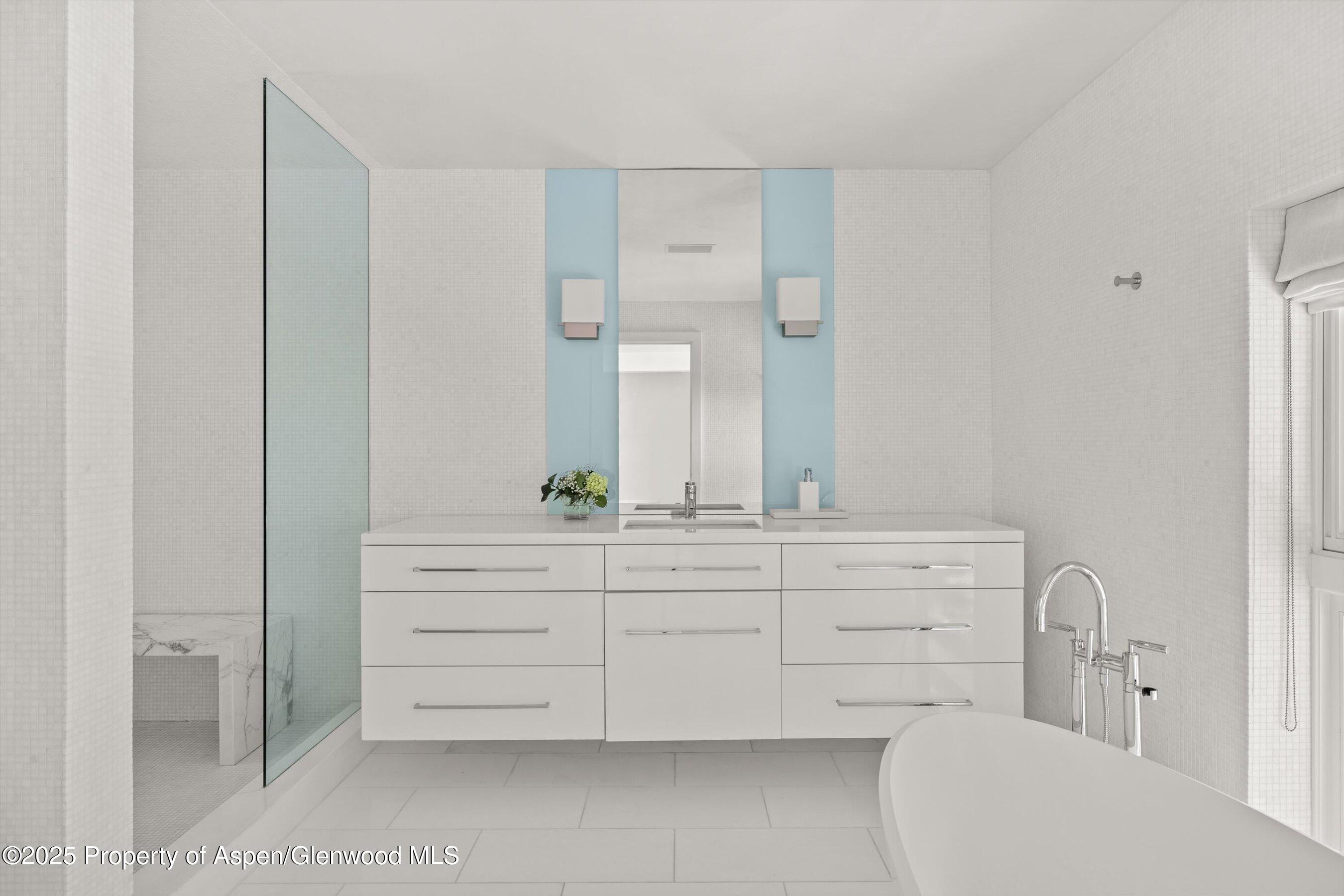 1220 Red Butte Drive Aspen, CO 81611 - Photo 24 of 27 a bathroom with a double vanity sink and mirror