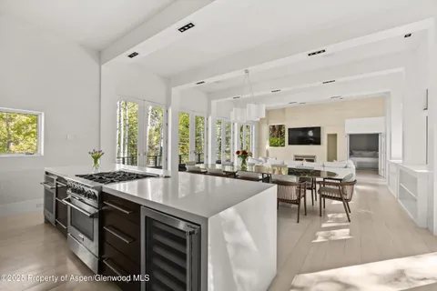 a view of a dining room with furniture window and outside view