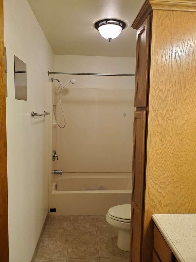 730 North 2853rd Road Utica, IL 61373 - Photo 11 of 23 a bathroom with a toilet and a shower
