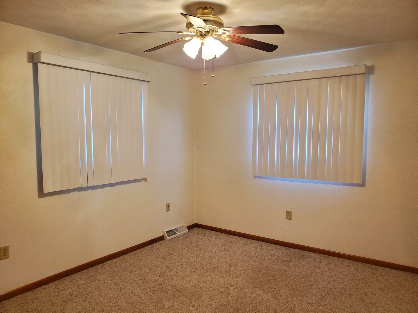 730 North 2853rd Road Utica, IL 61373 - Photo 7 of 23 a view of an empty room with window and chandelier fan