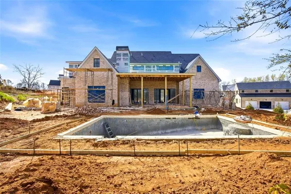 a view of a house with swimming pool