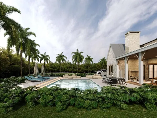 a swimming pool with outdoor seating and yard