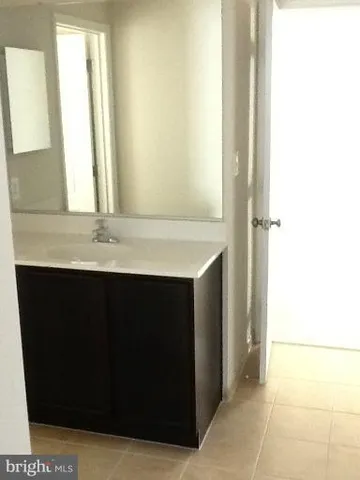 a kitchen with stainless steel appliances granite countertop a refrigerator and a stove