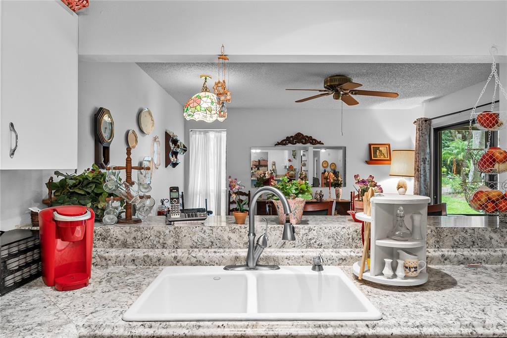 6642 Trail Ridge Drive, Unit 6642 Lakeland, FL 33813 - Photo 12 of 39 a room with lots of potted plants