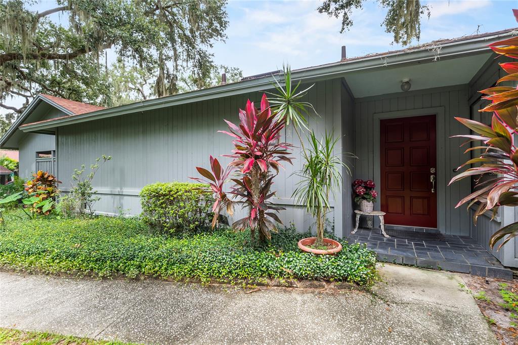 6642 Trail Ridge Drive, Unit 6642 Lakeland, FL 33813 - Photo 2 of 39 a front view of a house with a yard