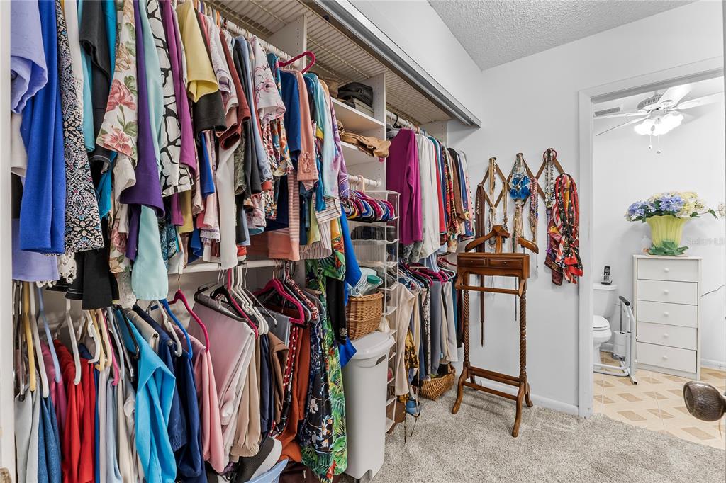 6642 Trail Ridge Drive, Unit 6642 Lakeland, FL 33813 - Photo 21 of 39 a view of walk in closet with clothes