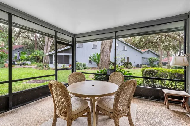 a view of an outdoor space with furniture and garden
