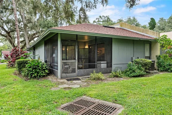 a view of a house with a yard and plants