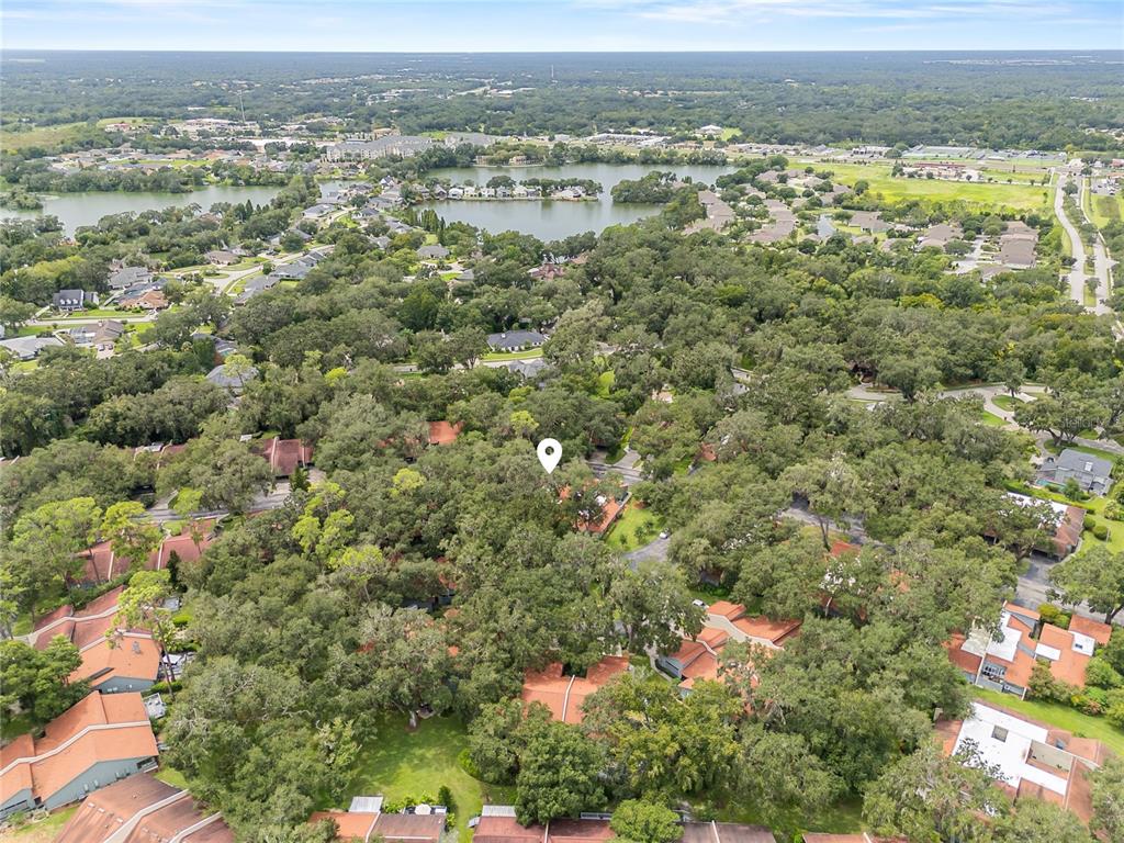 6642 Trail Ridge Drive, Unit 6642 Lakeland, FL 33813 - Photo 37 of 39 an aerial view of residential houses with outdoor space and trees