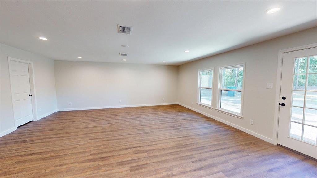 1110 Mill Run Road Athens, TX 75751 - Photo 11 of 32 wooden floor in an empty room with a window