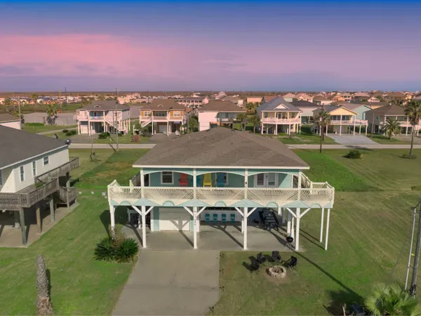 a front view of a house with outdoor seating