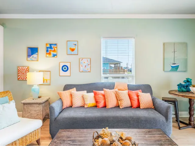 a bedroom with a bed and lamp next to a window