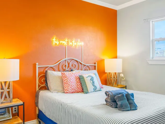 a street sign on a wall next to a building