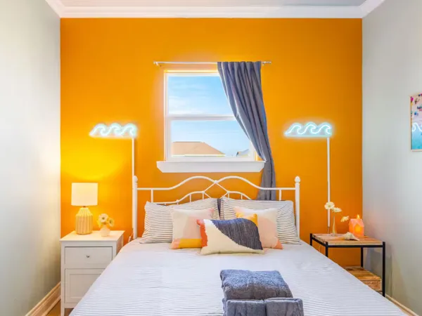 a bedroom with a bed and with view of bathroom