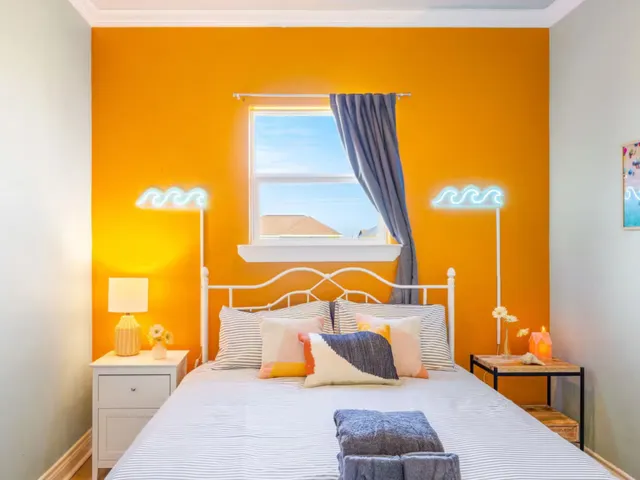 a bedroom with a bed and with view of bathroom