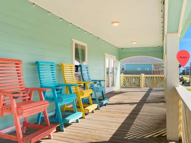 a living room with furniture and a book shelf