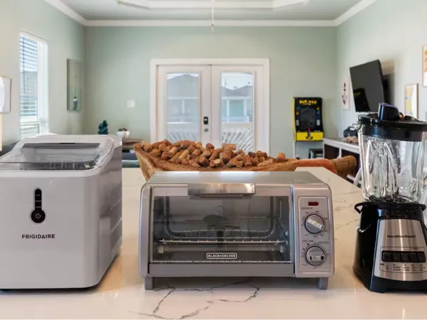 a kitchen with stainless steel appliances white cabinets and a window
