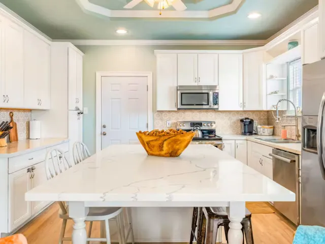 a living room with patio furniture and a couch
