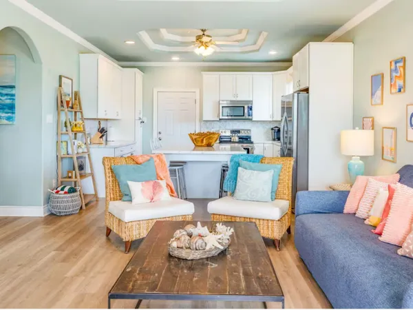 a blue couch sitting on a stool and a couch