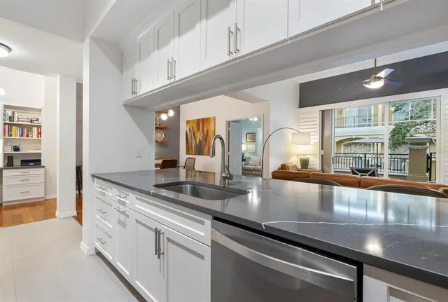 a large kitchen with granite countertop a lot of counter space