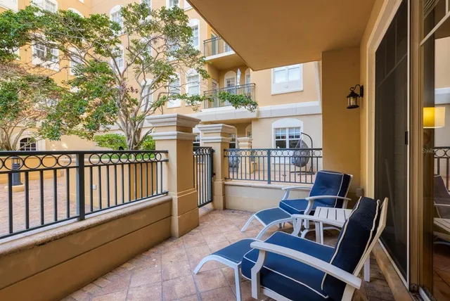 a balcony view with a seating space